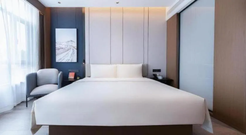 Bed in Atour Hotel Jinan Tangyan Century Avenue
