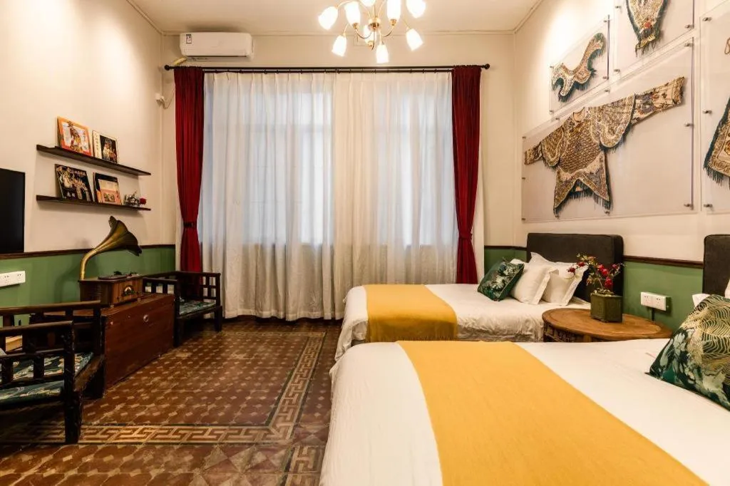 Bed in Origin Antique House and Hotel