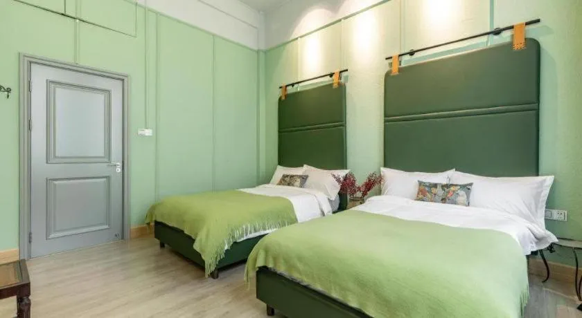 Bed in Origin Antique House and Hotel