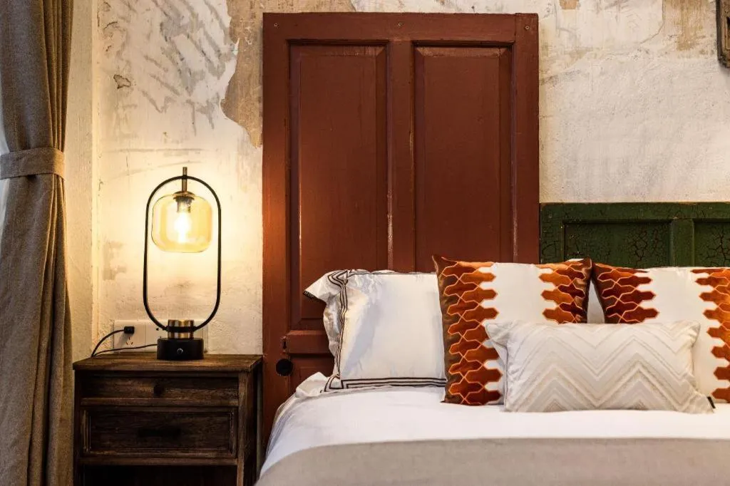 Bed in Origin Antique House and Hotel