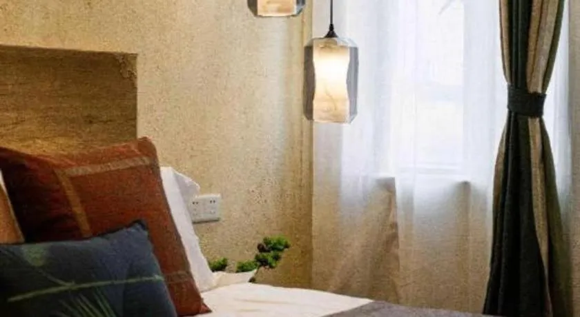 Bed in Origin Antique House and Hotel