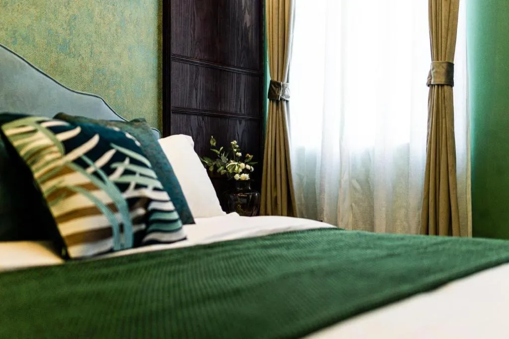 Bed in Origin Antique House and Hotel