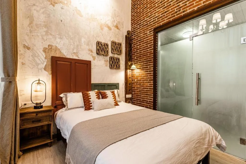 Bed in Origin Antique House and Hotel