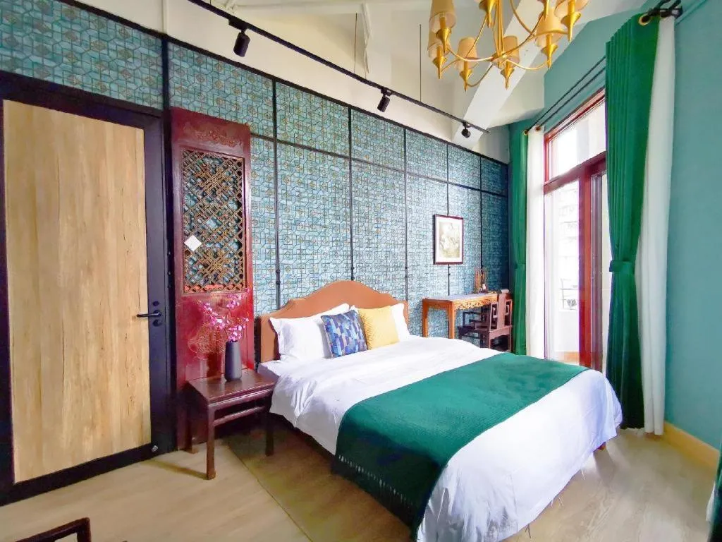 Bed in Origin Antique House and Hotel