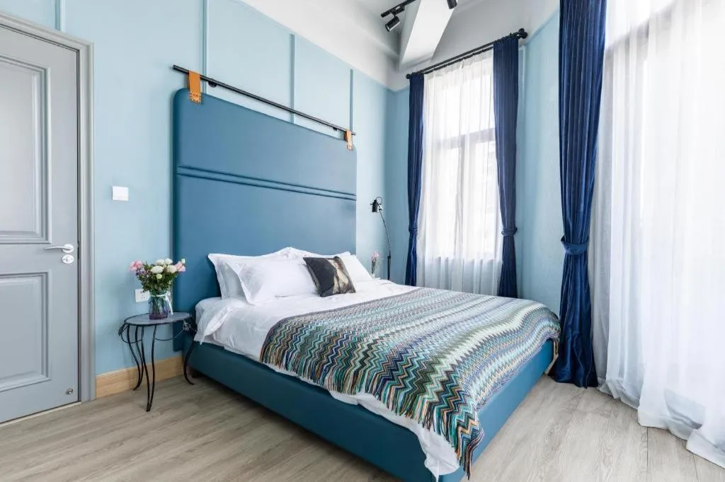 Bed in Origin Antique House and Hotel