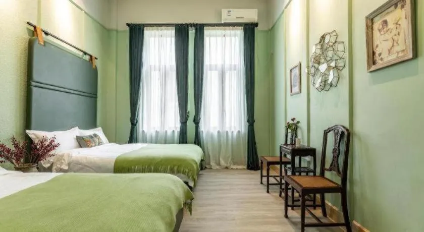 Bed in Origin Antique House and Hotel