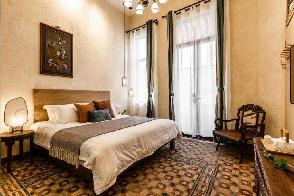 Bed in Origin Antique House and Hotel