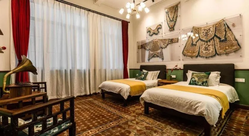 Bed in Origin Antique House and Hotel