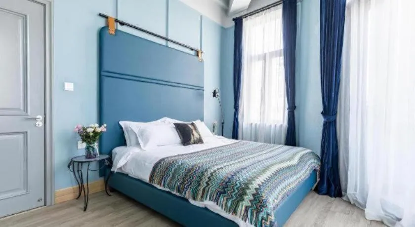 Bed in Origin Antique House and Hotel