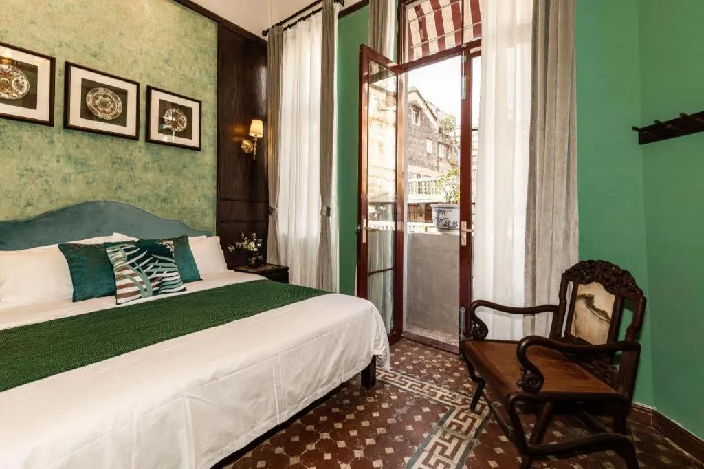 Bed in Origin Antique House and Hotel