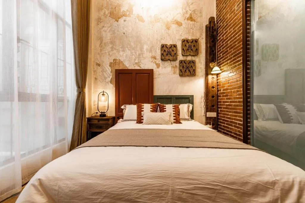 Bed in Origin Antique House and Hotel