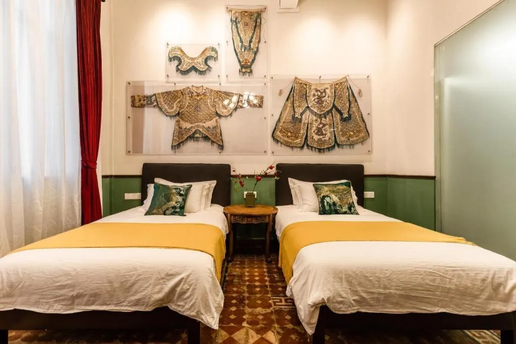 Bed in Origin Antique House and Hotel