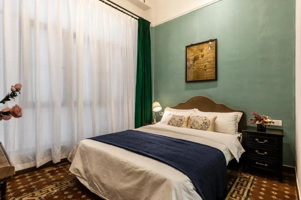 Bed in Origin Antique House and Hotel