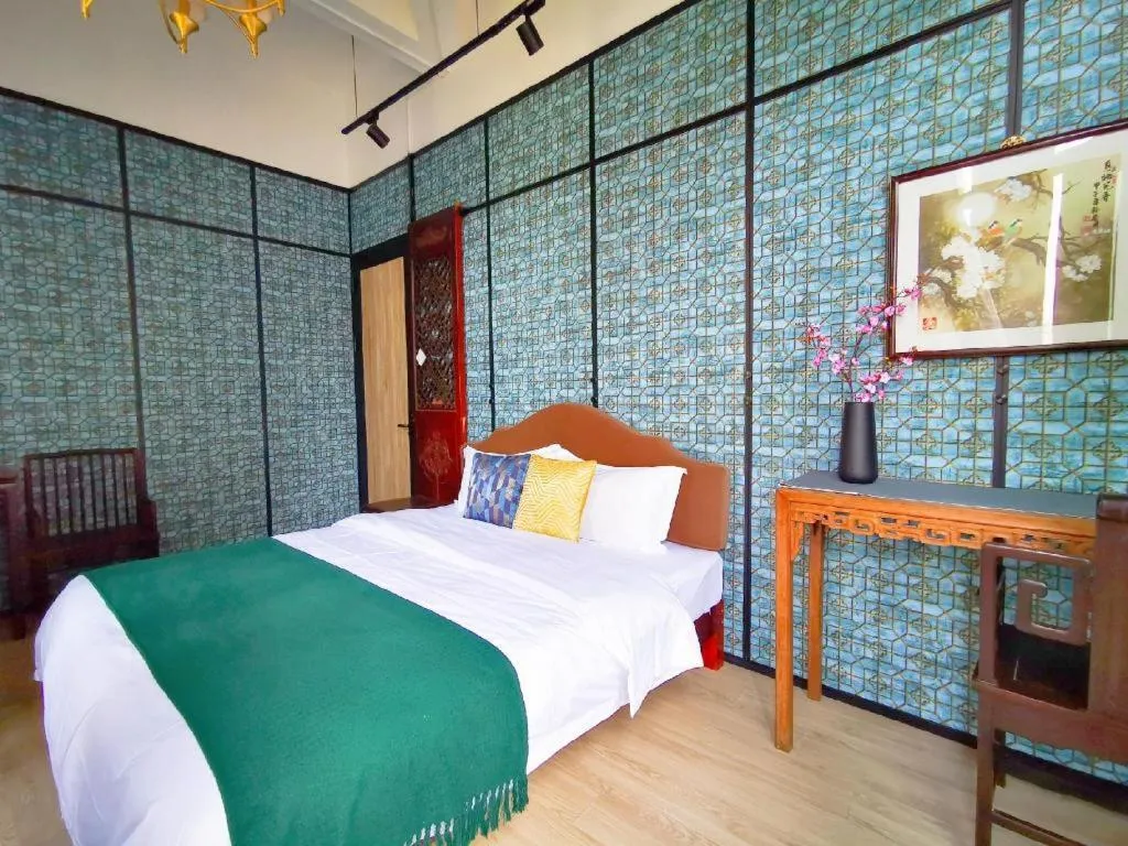 Bed in Origin Antique House and Hotel