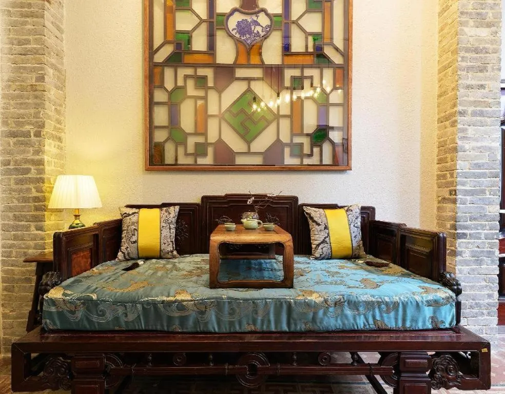 Bed in Origin Antique House and Hotel