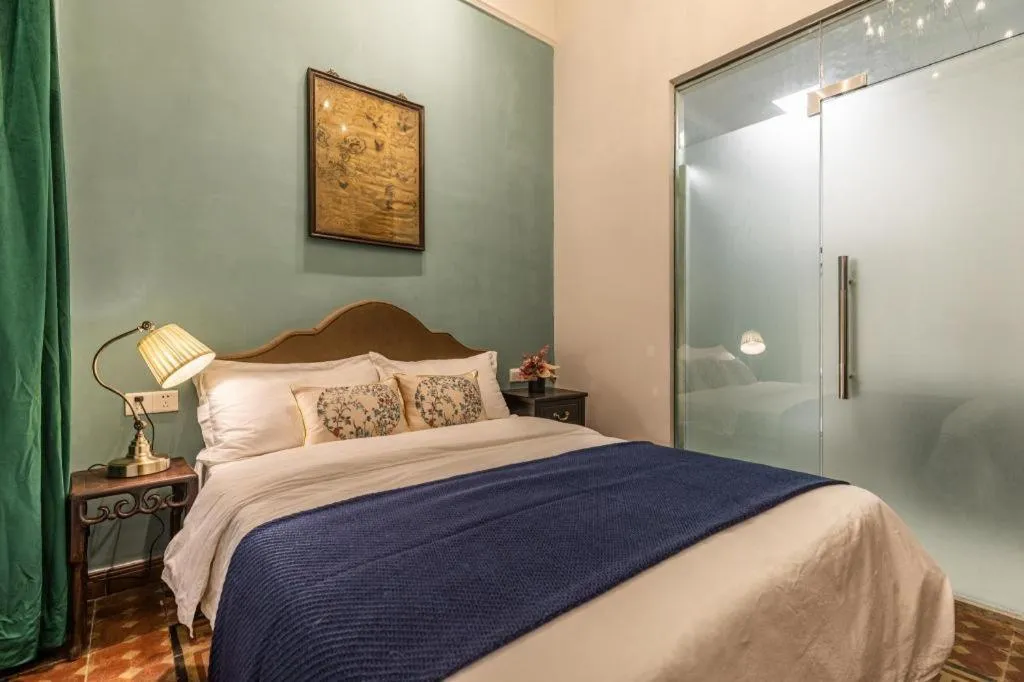 Bed in Origin Antique House and Hotel