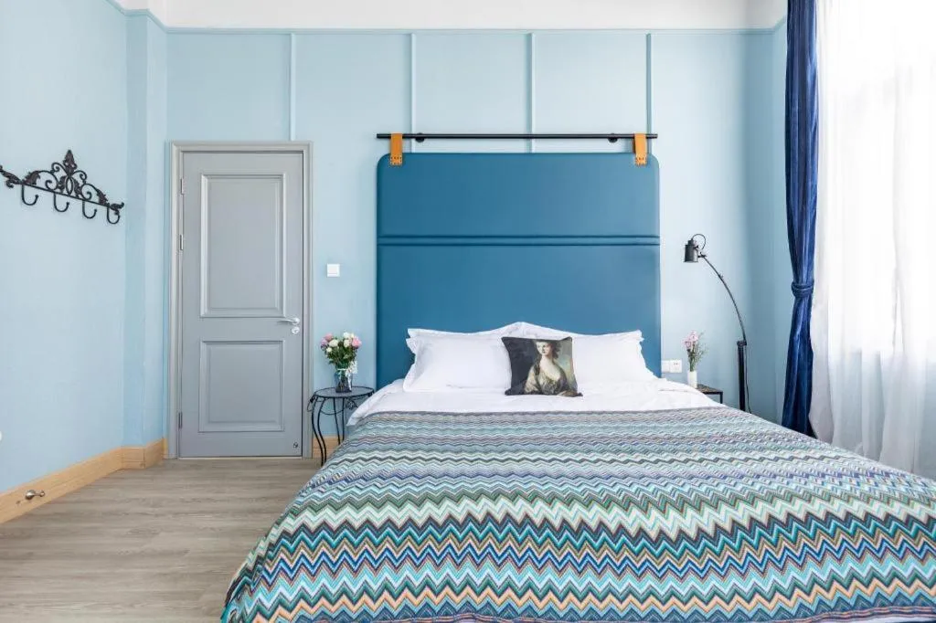 Bed in Origin Antique House and Hotel