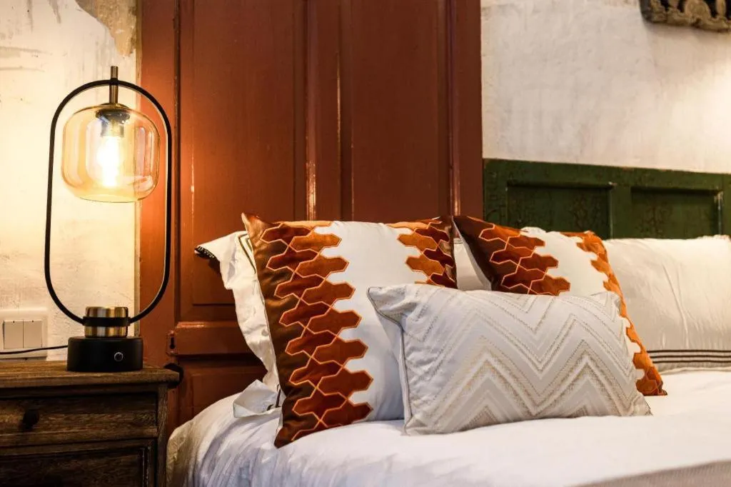 Bed in Origin Antique House and Hotel