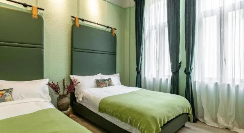 Bed in Origin Antique House and Hotel