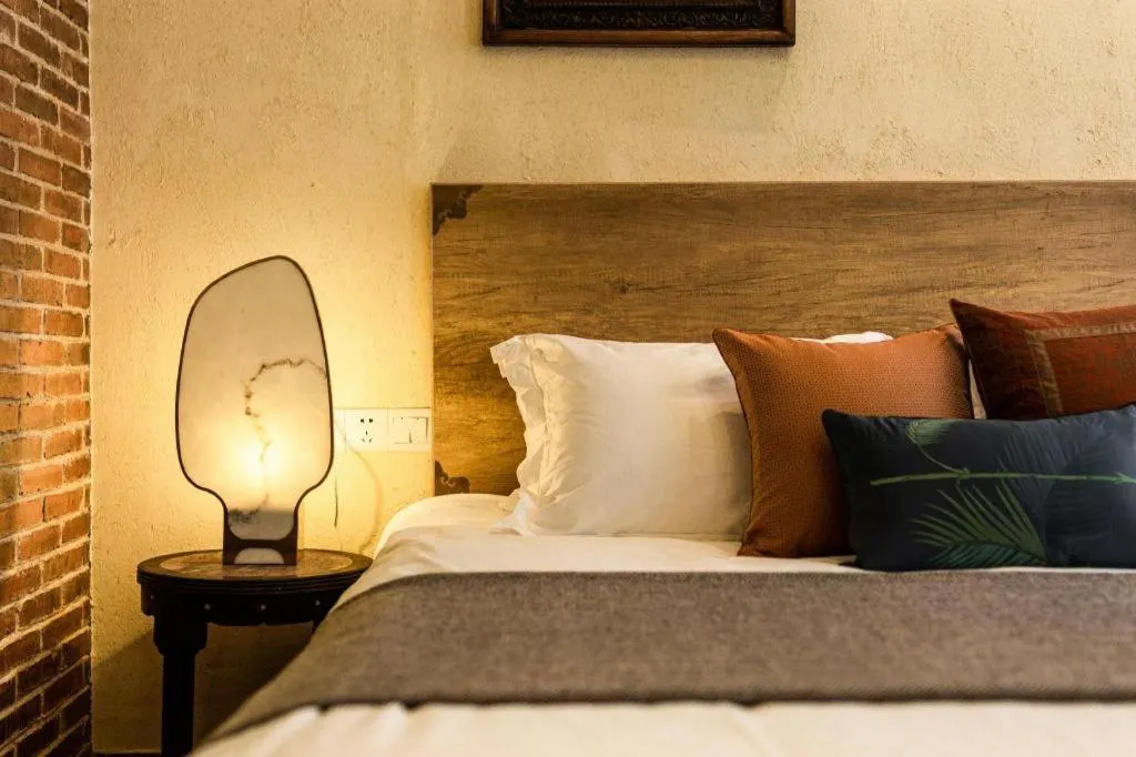 Bed in Origin Antique House and Hotel