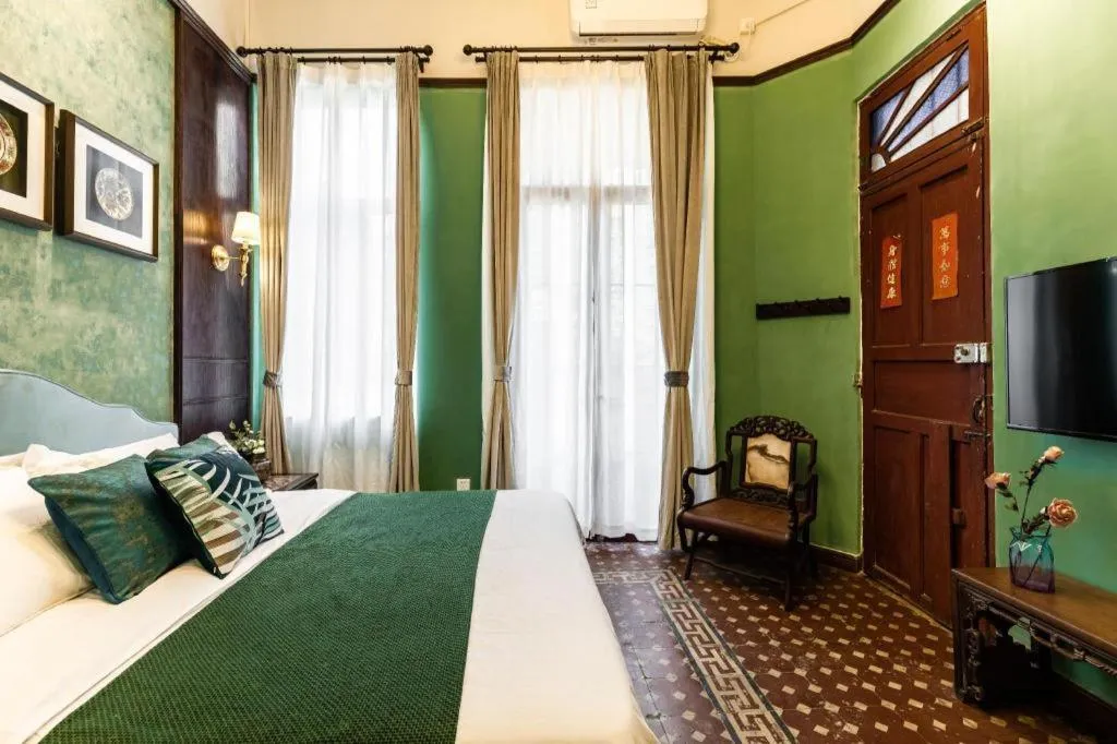 Bed in Origin Antique House and Hotel