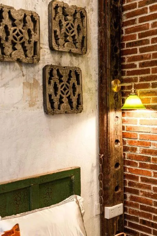 Bed in Origin Antique House and Hotel