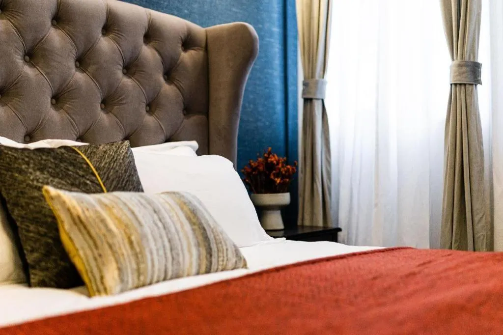 Bed in Origin Antique House and Hotel