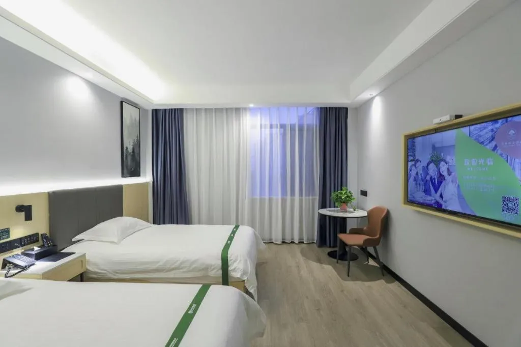 Bed in GreenTree Inn Express Fuyang University Town West High-Speed Railway Station