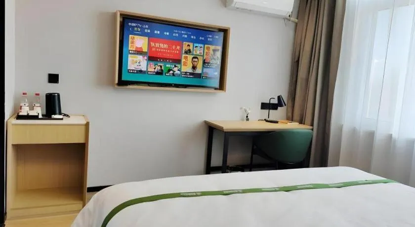 Bed in GreenTree Inn Express Qingdao Jiaodong International Airport