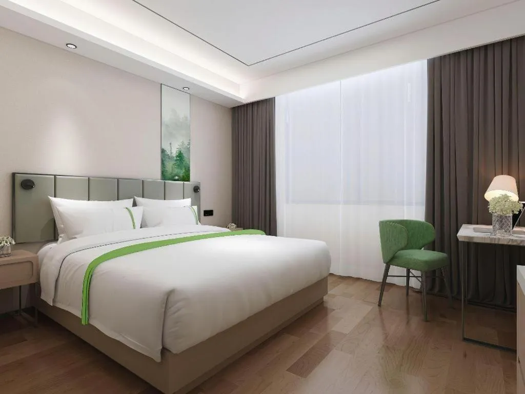 Bed in GreenTree Inn Express Qingdao Jiaodong International Airport