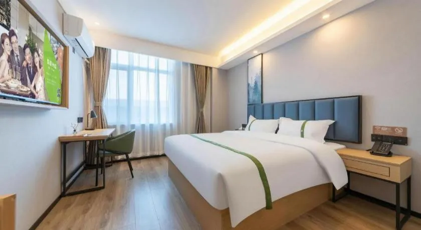 Bed in GreenTree Inn Express Qingdao Jiaodong International Airport