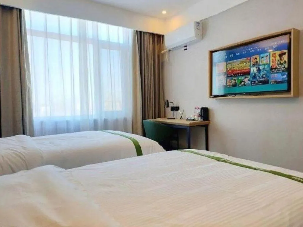 Bed in GreenTree Inn Express Qingdao Jiaodong International Airport