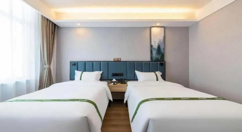 Bed in GreenTree Inn Express Qingdao Jiaodong International Airport