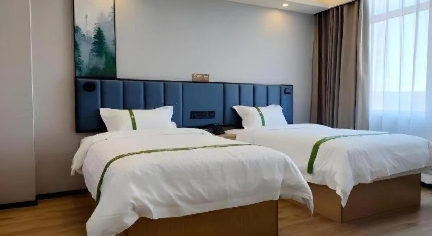 Bed in GreenTree Inn Express Qingdao Jiaodong International Airport