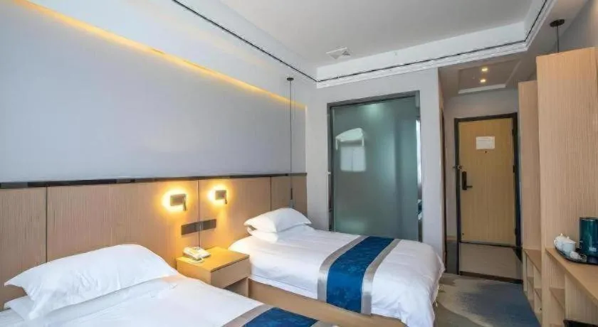 Bed in GELI Hotel Huainan Railway Station Sports Center