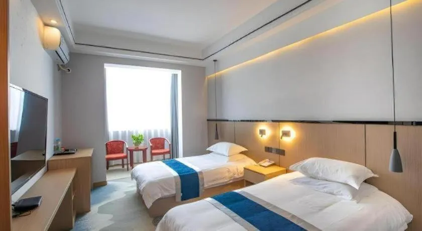 Bed in GELI Hotel Huainan Railway Station Sports Center