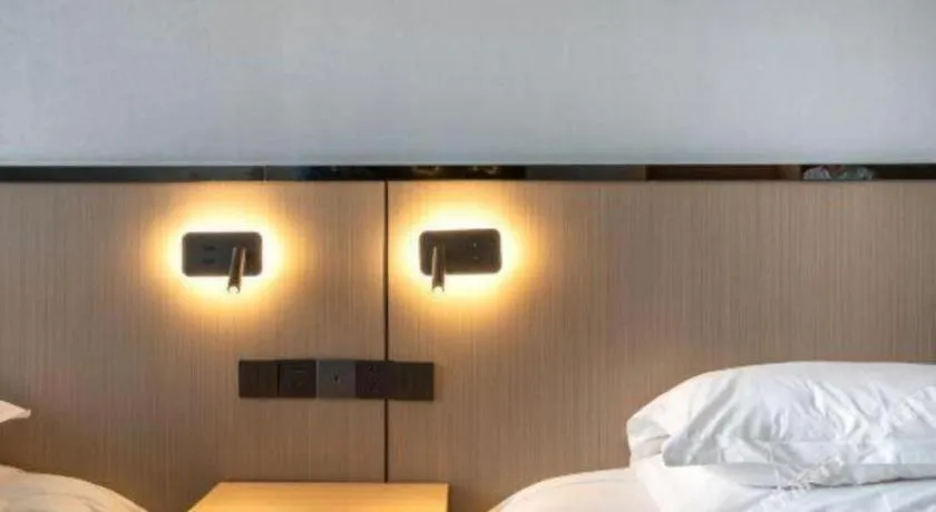 Bed in GELI Hotel Huainan Railway Station Sports Center