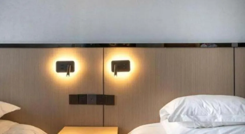 Bed in GELI Hotel Huainan Railway Station Sports Center