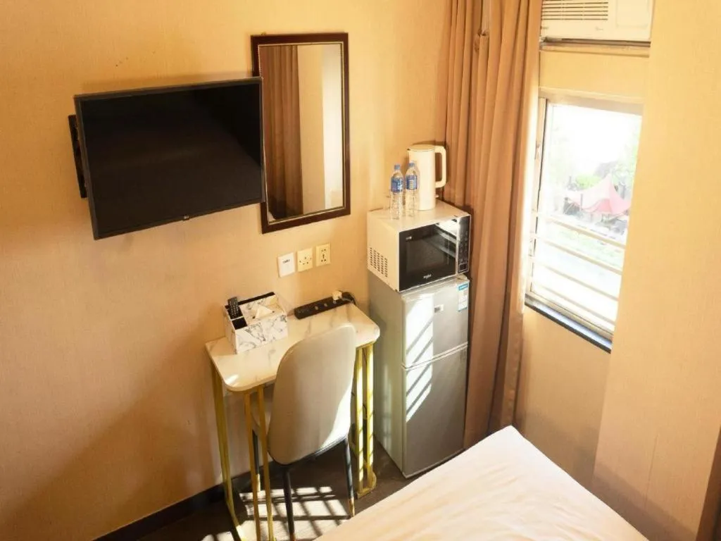 Bed in Sunny Day Hotel