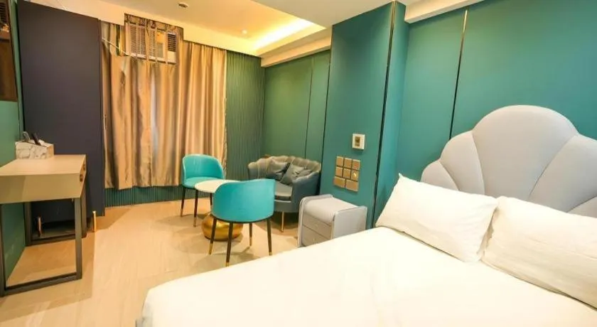 Bed in Sunny Day Hotel