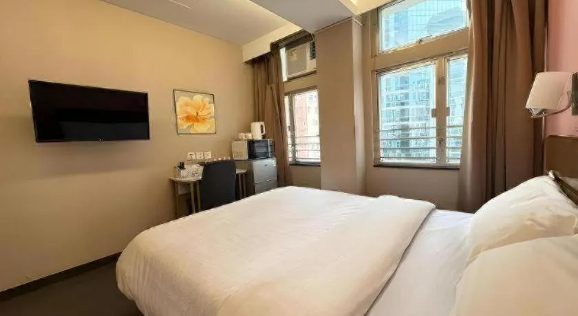 Bed in Sunny Day Hotel