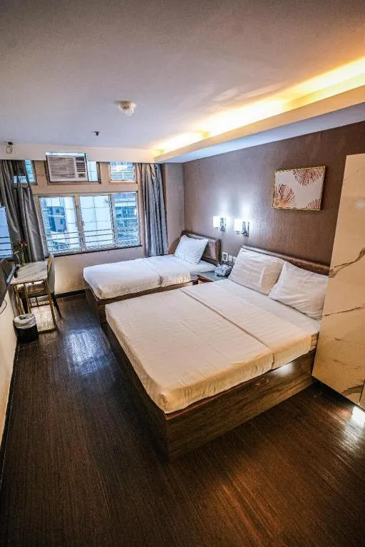 Bed in Sunny Day Hotel