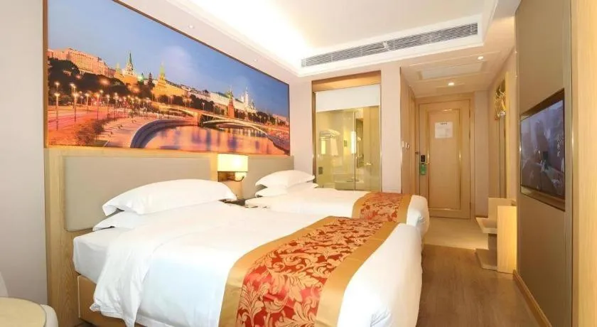 Bed in SHANGJINGHAO HOTEL （SAKATA SNOW ELEPHANT SUBWAY STATION SHOP）