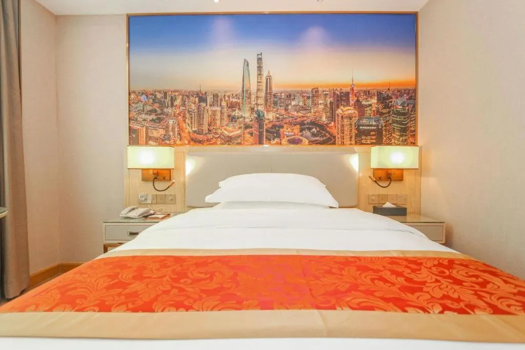 Bed in SHANGJINGHAO HOTEL （SAKATA SNOW ELEPHANT SUBWAY STATION SHOP）