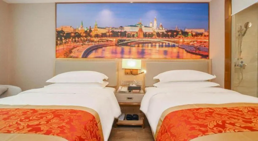 Bed in SHANGJINGHAO HOTEL （SAKATA SNOW ELEPHANT SUBWAY STATION SHOP）