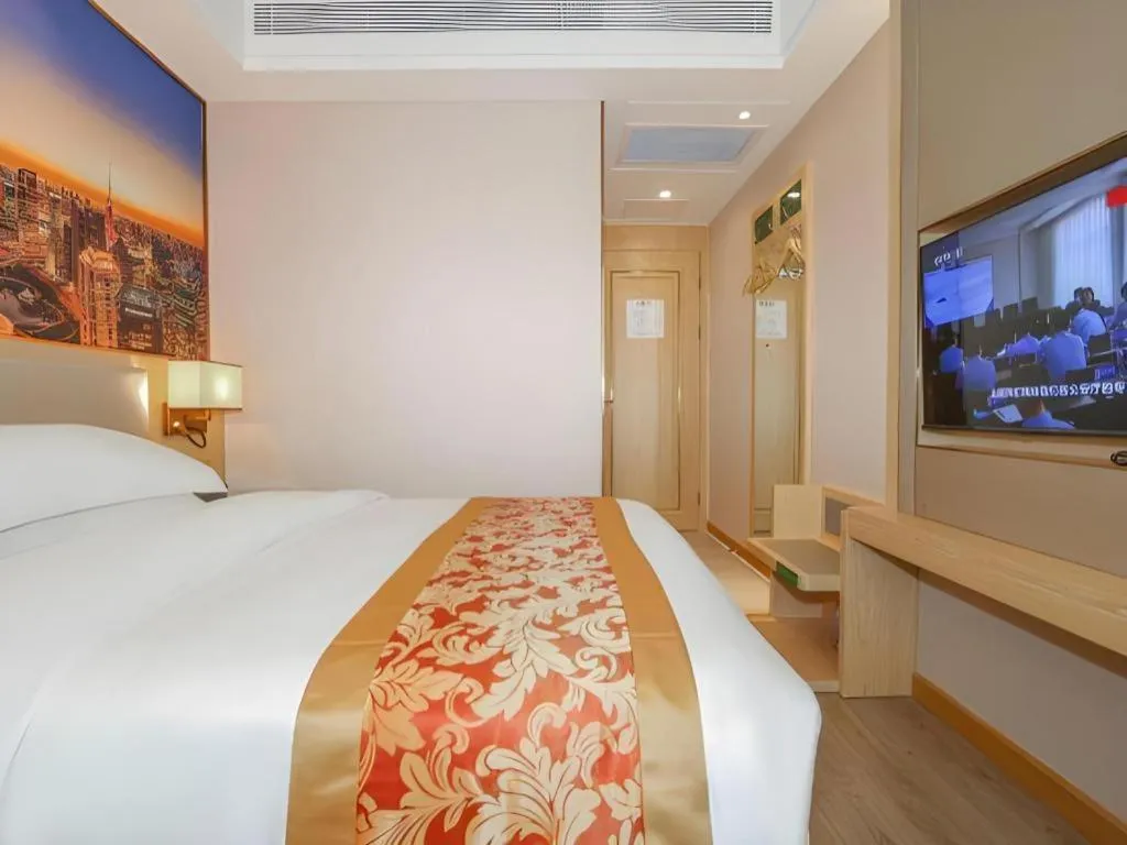 Bed in SHANGJINGHAO HOTEL （SAKATA SNOW ELEPHANT SUBWAY STATION SHOP）