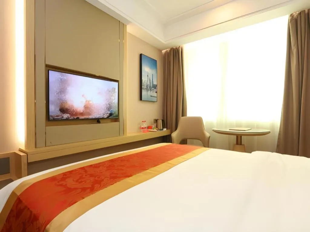 Bed in SHANGJINGHAO HOTEL （SAKATA SNOW ELEPHANT SUBWAY STATION SHOP）