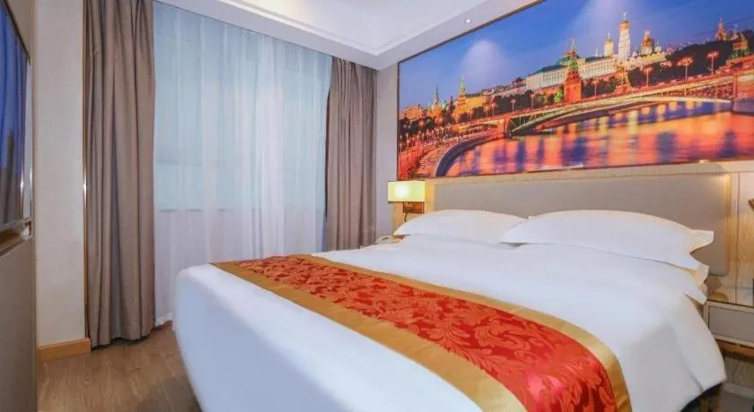 Bed in SHANGJINGHAO HOTEL （SAKATA SNOW ELEPHANT SUBWAY STATION SHOP）