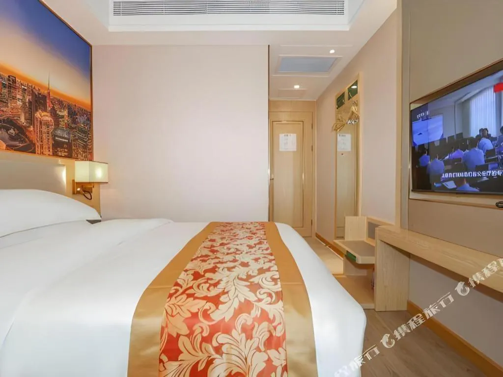 Bed in SHANGJINGHAO HOTEL （SAKATA SNOW ELEPHANT SUBWAY STATION SHOP）