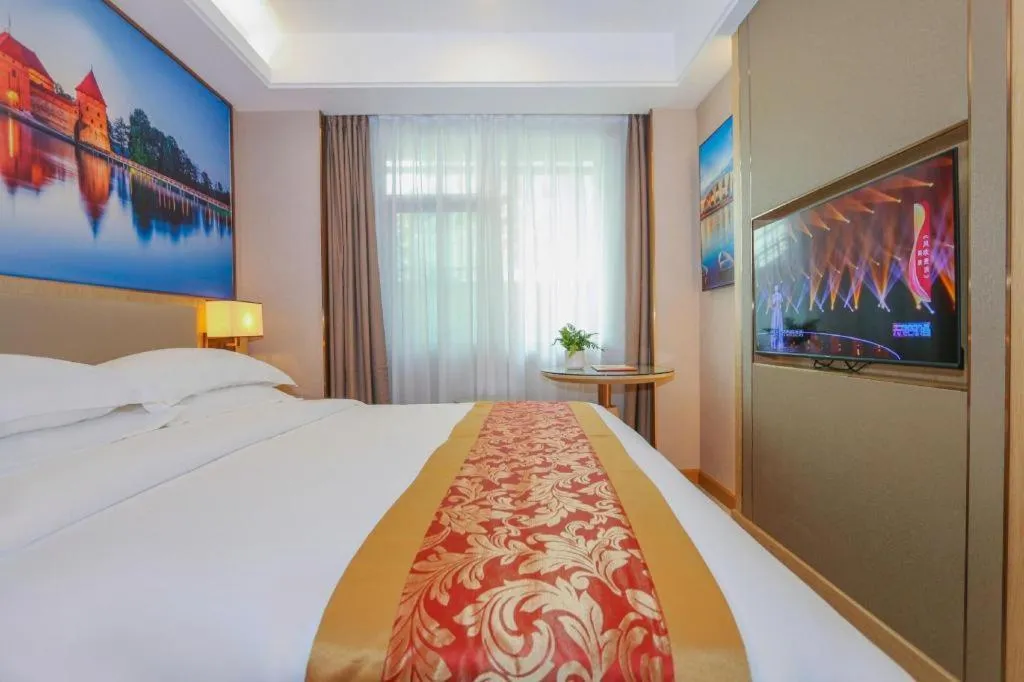 Bed in SHANGJINGHAO HOTEL （SAKATA SNOW ELEPHANT SUBWAY STATION SHOP）